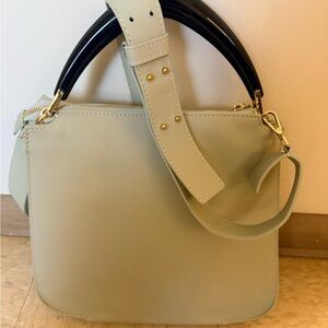 Elegant Sea Foam Green Leather Handbag with Black Accents